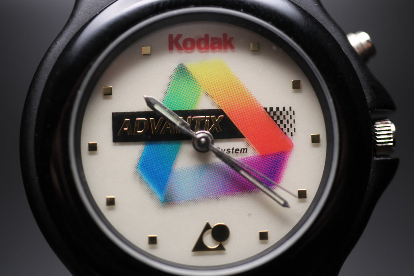 Watch with a colorful logo on the dial, featuring the Kodak brand.